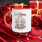 A white ceramic mug with a red interior and handle, printed with the text 'DEAR SANTA, BEFORE I EXPLAIN.
