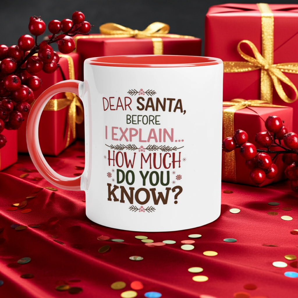 A white ceramic mug with a red interior and handle, printed with the text 'DEAR SANTA, BEFORE I EXPLAIN.